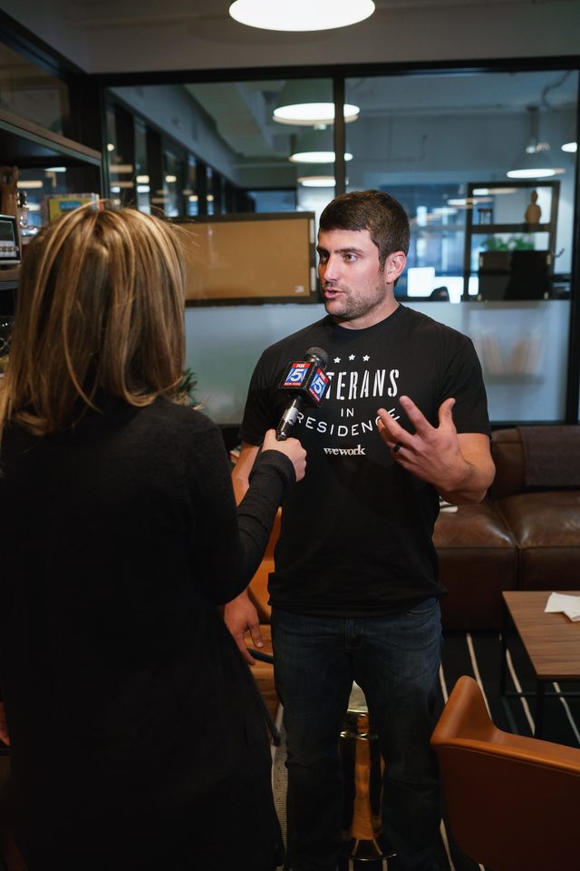 Trevor Shirk, founder of VETS Growth Marketing, answering questions in a television interview